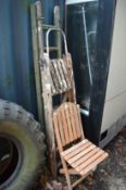 Folding chair and two folding step ladders.