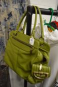 A green leather handbag.