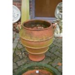 A large terracotta planter.