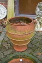 A large terracotta planter.