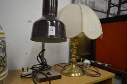 A desk lamp and a brass table lamp.