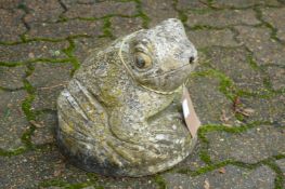 A reconstituted stone garden fountain modelled as a frog.