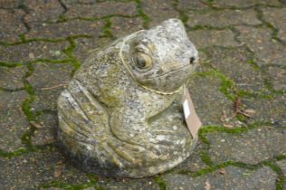 A reconstituted stone garden fountain modelled as a frog.