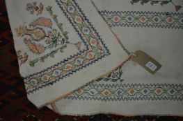 A needlework decorated bedspread with a floral design 6ft 3" x 4ft.