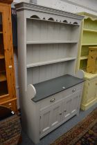 A decoratively painted pine dresser.