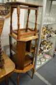 An oak occasional table/bookcase together with two other oak occasional tables.