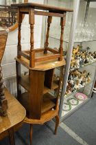 An oak occasional table/bookcase together with two other oak occasional tables.