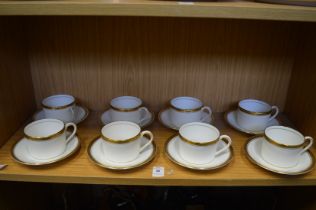 A set of eight Coalport Elite-Gold coffee cups and saucers.