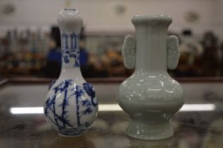 A Chinese miniature celadon glazed vase together with a miniature Chinese blue and white vase.
