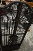 A wrought iron folding mirror (mirror plate cracked).