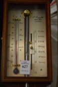A Comitti stick barometer.