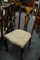 A set of four Edwardian inlaid mahogany high back dining chairs.