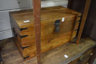 A small teak trunk.