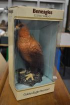 Beneagles Scotch whisky, a golden eagle decanter with contents, boxed.