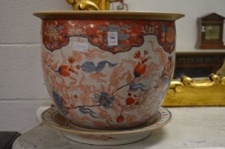 A large Imari style jardiniere and stand.