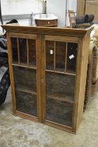 Pine two door display cabinet.