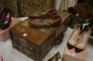 A good early shoe trunk applied with many travel labels together with a pair of gentleman's