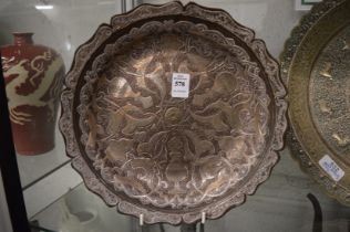 A good Eastern heavy tinned copper circular dish with incised white metal decoration.