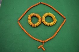 A collection of amber style bead necklaces.