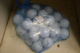 A bag of fifty Pinnacle golf balls.