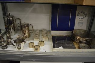 Silver plated place mats, napkin rings etc.