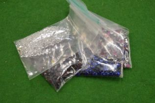 Various bags of coloured spinels.