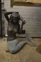 A good large cast bronze water feature modelled as a mermaid holding a shell.