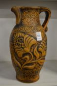 A German moulded pottery jug.