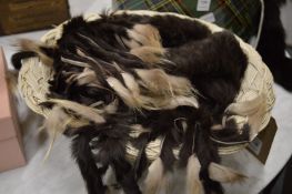A basket containing a quantity of fur tails.