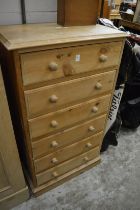 A pine six drawer chest.