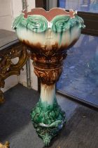 A Victorian majolica glazed jardiniere with matching stand.