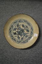 A Chinese blue and white circular dish.