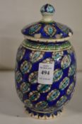 An Iznik style jar and cover.