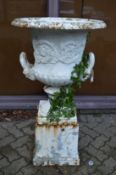 A good large campagna cast iron twin handled garden urn on pedestal base.