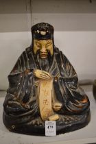 A Chinese lacquer model of a seated Buddha.