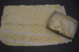 A yellow tablecloth with matching napkins.