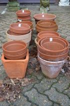 A quantity of terracotta plant pots.