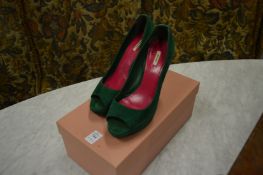 A pair of ladies Miu Miu green suede shoes, size 37, boxed.