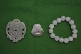 Chinese jade amulets together with a bead bangle.