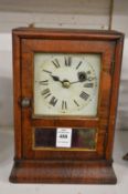 A small rosewood cased mantle clock.