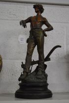 A spelter figure of a farmer.