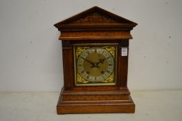 A good oak architectural case mantle clock.
