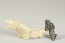 AN ANCIENT GREEK CARVED MARBLE OR AGATE LION FIGURE, 13cm long, together with an Egyptian bronze