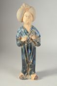 A CHINESE GLAZED POTTERY FIGURE, 35cm high.
