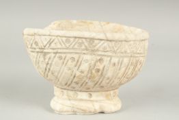 A RARE 11TH - 12TH CENTURY POSSIBLY ANDLUSIAN ALMOHAD SPANISH CARVED WHITE MARBLE FOOTED BOWL, 19.