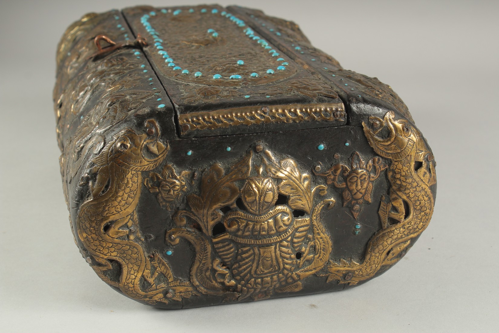 A TIBETAN TURQUOISE INSET BRASS MOUNTED WOODEN BOX, 35cm x 21cm. - Image 6 of 7