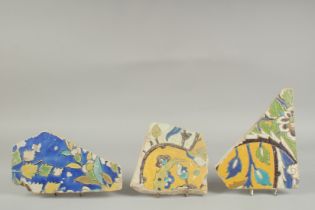 THREE 17TH CENTURY PERSIAN SAFAVID TILE FRAGMENTS, (3).