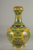 A CHINESE YELLOW GROUND PORCELAIN 'GARLIC HEAD' VASE, with character mark to base, 24cm high.