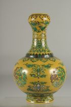 A CHINESE YELLOW GROUND PORCELAIN 'GARLIC HEAD' VASE, with character mark to base, 24cm high.
