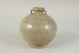 A CHINESE CELADON GLAZED POTTERY TWIN HANDLE VESSEL, with carved decoration to the shoulder, 15cm